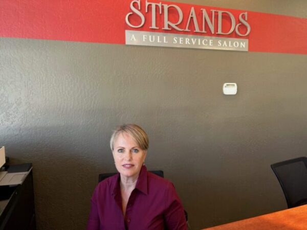 Lisa, the owner of Strands For Hair